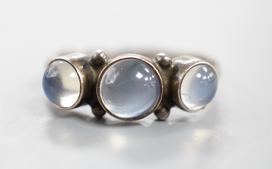 A Georg Jensen sterling 925 and three stone cabochon moonstone set half hoop ring, no. 3, size M/N, in Georg Jensen box.